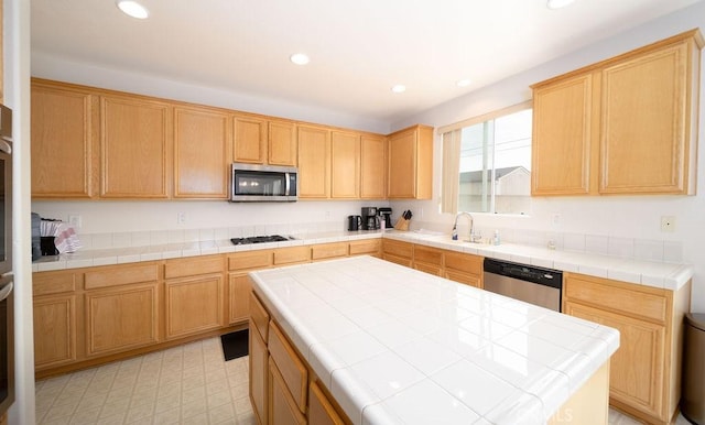 6933 Rio Grande Dr, Eastvale, CA 91752 - kitchen with stainless steel appliances, a sink, tile countertops, recessed lighting, and a center island