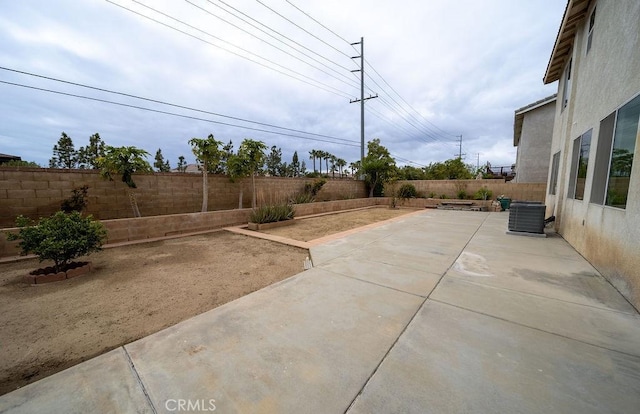 6933 Rio Grande Dr, Eastvale, CA 91752 - fenced backyard featuring a patio area