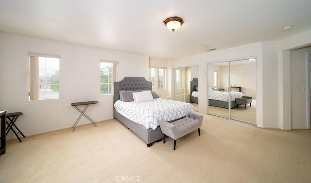 6933 Rio Grande Dr, Eastvale, CA 91752 - carpeted bedroom with multiple closets and baseboards