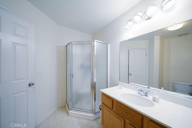 6933 Rio Grande Dr, Eastvale, CA 91752 - bathroom featuring vanity, a stall shower, toilet, and tile patterned floors