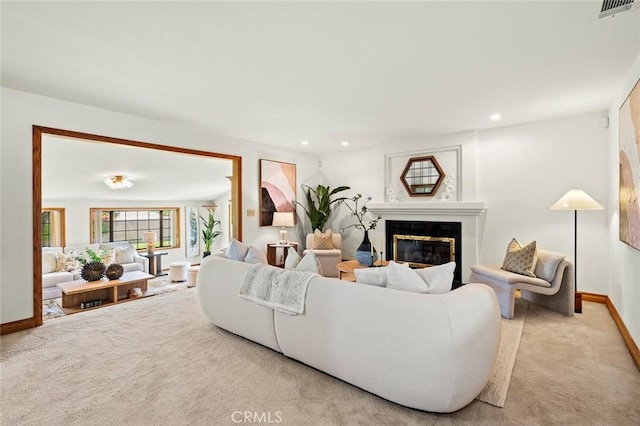 1038 E Meda Ave, Glendora, CA 91741 - living area featuring carpet floors, baseboards, a glass covered fireplace, and recessed lighting