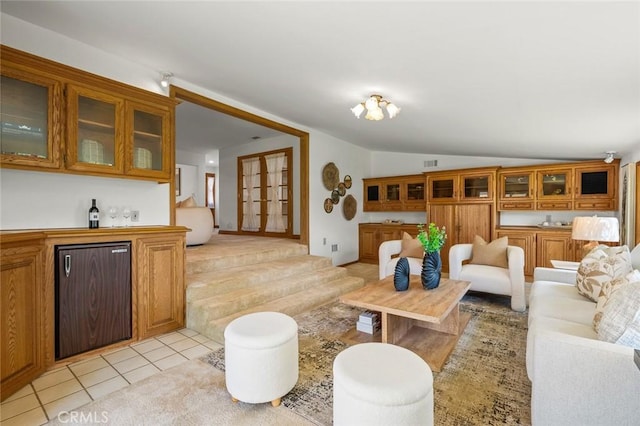 1038 E Meda Ave, Glendora, CA 91741 - living room featuring lofted ceiling, light tile patterned floors, and bar