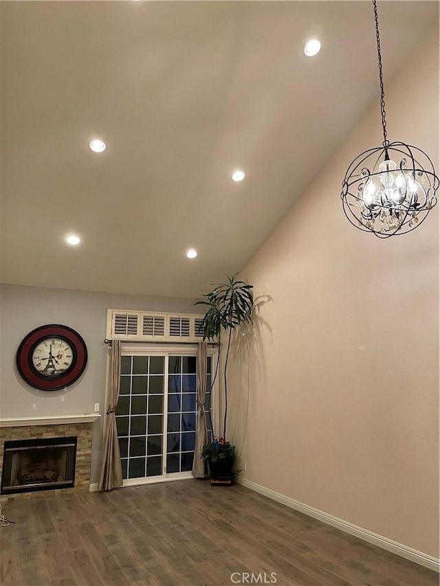 2929 Crape Myrtle Cir, Chino Hills, CA 91709 - unfurnished living room featuring a chandelier, wood finished floors, recessed lighting, baseboards, and a glass covered fireplace