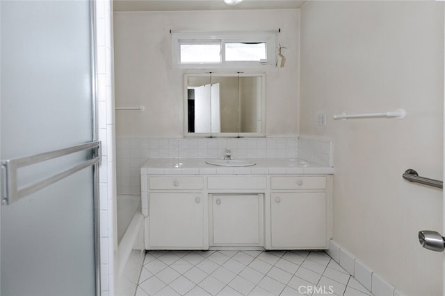 13727 Leadwell St, Van Nuys, CA 91405 - full bathroom with tile patterned flooring, vanity, and a bath