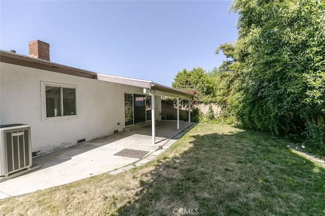 13727 Leadwell St, Van Nuys, CA 91405 - view of green lawn with central AC unit and a patio area