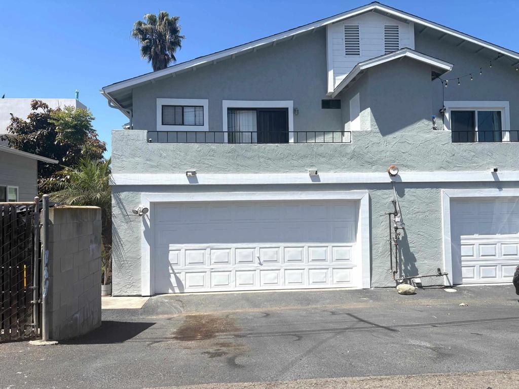 1922 Broadway Unit C, Oceanside, CA 92054 - view of property exterior with stucco siding and a garage