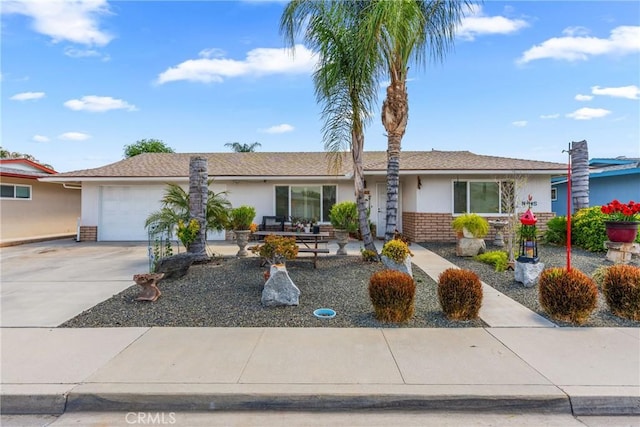 1561 W Wesley Pl, Hemet, CA 92543 - ranch-style house featuring a garage, stucco siding, and concrete driveway