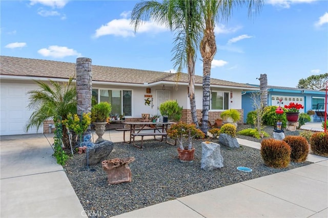 1561 W Wesley Pl, Hemet, CA 92543 - single story home featuring stucco siding, a garage, and driveway