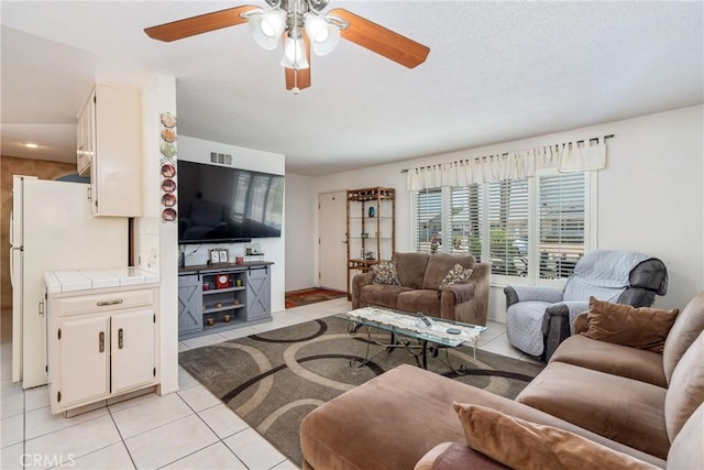 1561 W Wesley Pl, Hemet, CA 92543 - living area featuring light tile patterned floors and a ceiling fan