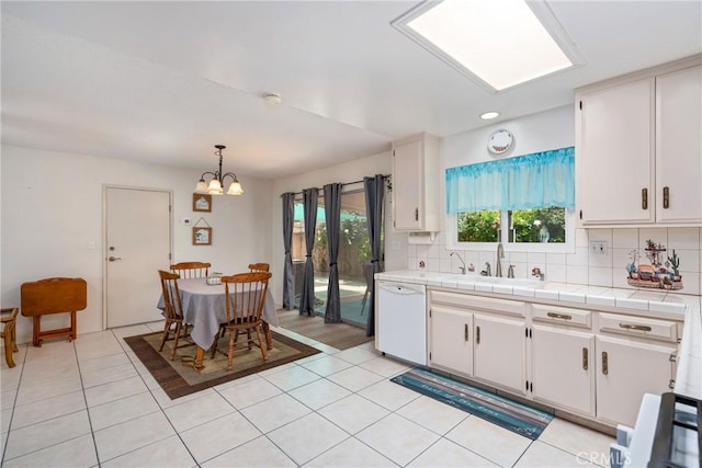 1561 W Wesley Pl, Hemet, CA 92543 - kitchen featuring a sink, white dishwasher, a chandelier, tasteful backsplash, and tile countertops