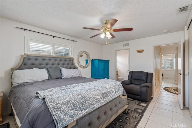 1561 W Wesley Pl, Hemet, CA 92543 - bedroom featuring multiple windows, light tile patterned flooring, a textured ceiling, and ceiling fan