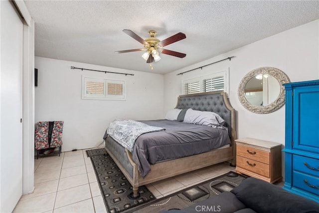 1561 W Wesley Pl, Hemet, CA 92543 - bedroom with light tile patterned flooring, a textured ceiling, and a ceiling fan