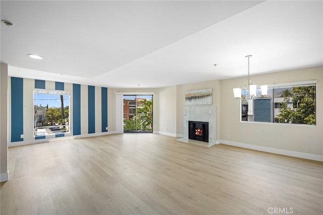 450 W Dryden St Unit 201, Glendale, CA 91202 - unfurnished living room with baseboards, wood finished floors, plenty of natural light, and recessed lighting