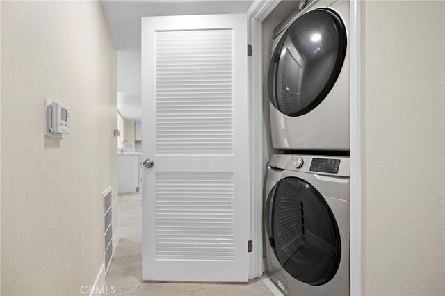 450 W Dryden St Unit 201, Glendale, CA 91202 - laundry room with estacked washer and dryer and light wood finished floors