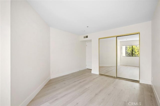450 W Dryden St Unit 201, Glendale, CA 91202 - unfurnished bedroom featuring wood finished floors, baseboards, and a closet