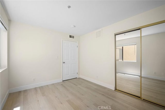 450 W Dryden St Unit 201, Glendale, CA 91202 - unfurnished bedroom featuring light wood-type flooring, baseboards, and a closet