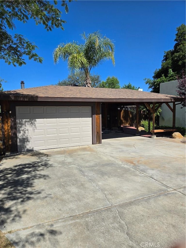 4677 Silver Saddle Ln, Paso Robles, CA 93446 - garage featuring concrete driveway and a carport