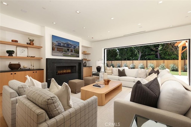 1991 Port Claridge Pl, Newport Beach, CA 92660 - living room with a warm lit fireplace, light carpet, and recessed lighting