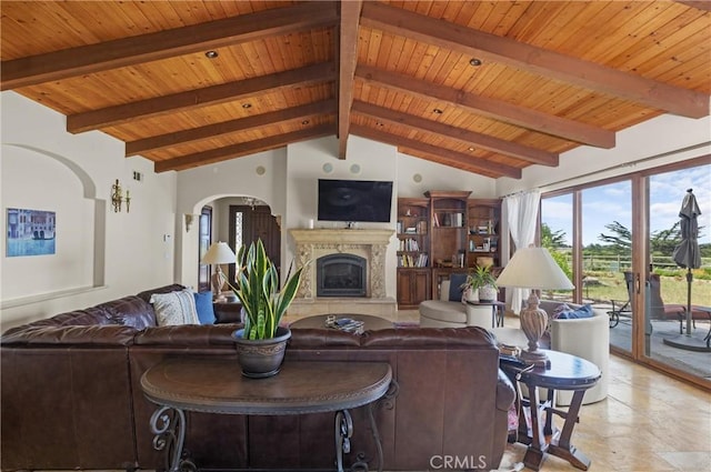 295 Via Piedras Blancas, San Simeon, CA 93452 - living room featuring wooden ceiling, a premium fireplace, and stone tile flooring