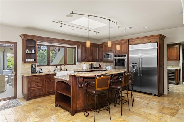 295 Via Piedras Blancas, San Simeon, CA 93452 - kitchen with built in appliances, open shelves, a sink, and decorative backsplash