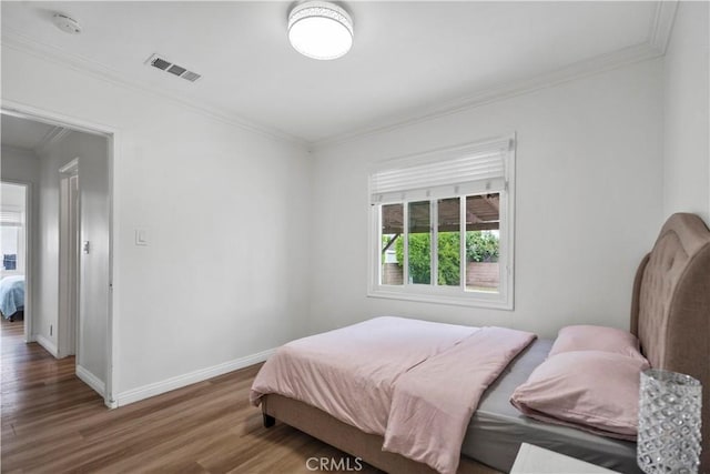 1812 S Granada Ave, Alhambra, CA 91801 - bedroom featuring wood finished floors, crown molding, and baseboards