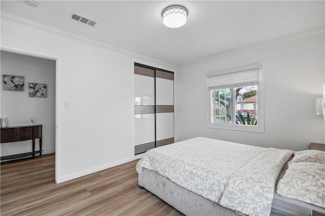 1812 S Granada Ave, Alhambra, CA 91801 - bedroom featuring crown molding, wood finished floors, a closet, and baseboards