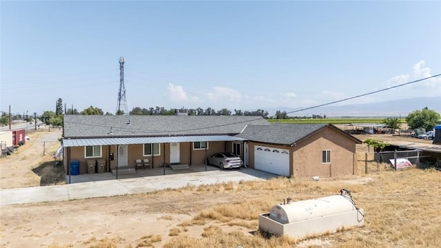 5915 Weedpatch, Bakersfield, CA 93307 - view of front facade featuring an attached garage and driveway