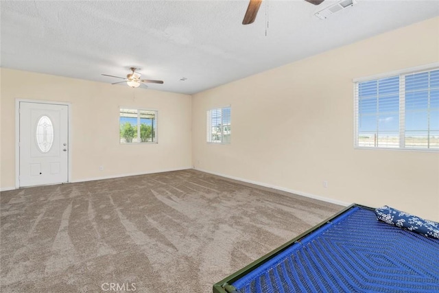 5915 Weedpatch, Bakersfield, CA 93307 - unfurnished bedroom with carpet, baseboards, ceiling fan, and a textured ceiling