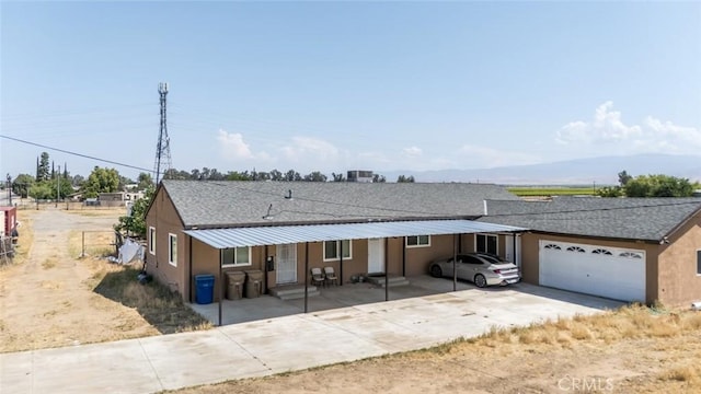 5915 Weedpatch, Bakersfield, CA 93307 - ranch-style house with an attached garage, driveway, and a shingled roof