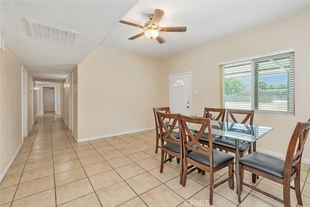 5915 Weedpatch, Bakersfield, CA 93307 - dining room with light tile patterned floors, ceiling fan, baseboards, and a textured ceiling