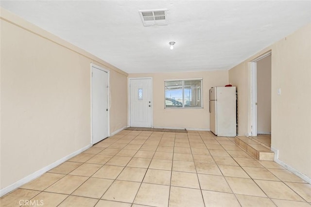 5915 Weedpatch, Bakersfield, CA 93307 - unfurnished room with baseboards and light tile patterned floors