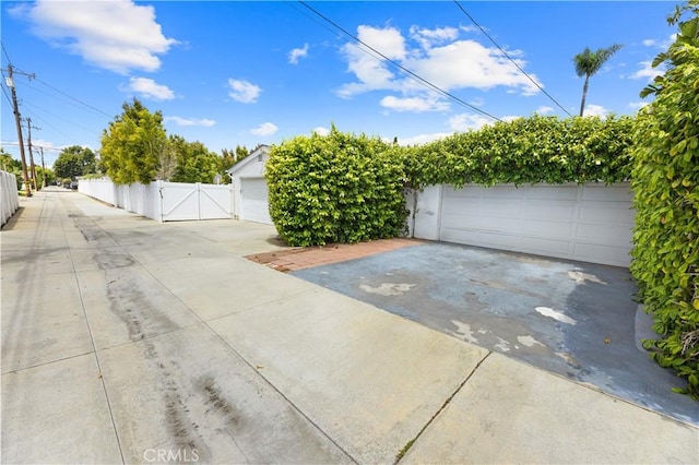 317 Walnut St, Costa Mesa, CA 92627 - detached garage featuring a gate