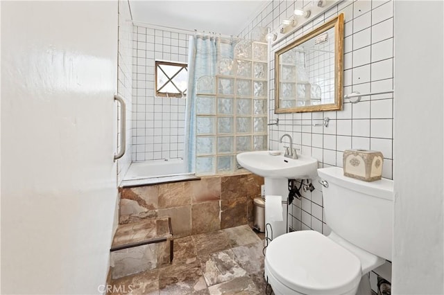 317 Walnut St, Costa Mesa, CA 92627 - full bathroom with tile walls, toilet, and tiled shower / bath