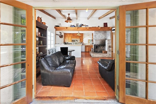 317 Walnut St, Costa Mesa, CA 92627 - tiled living area featuring beamed ceiling and a brick fireplace