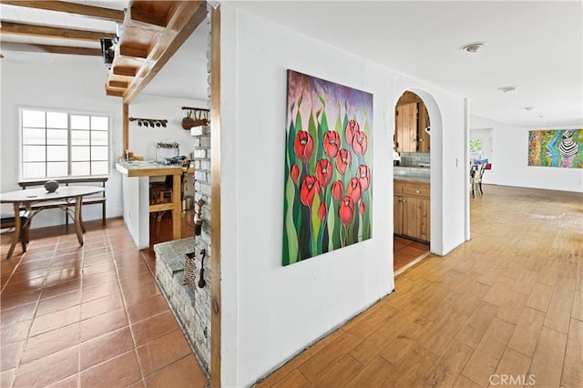 317 Walnut St, Costa Mesa, CA 92627 - hall with arched walkways and wood finished floors