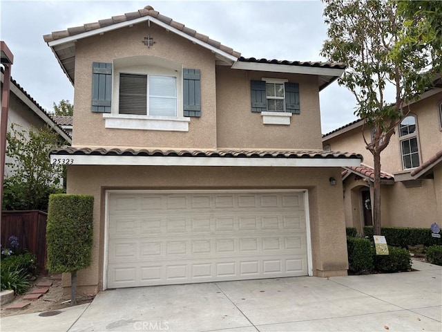 25323 Bayside Pl, Harbor City, CA 90710 - view of front facade with a tiled roof, an attached garage, and stucco siding