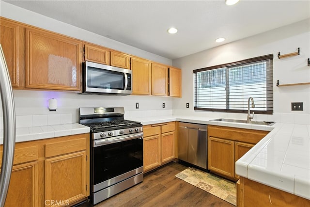 25323 Bayside Pl, Harbor City, CA 90710 - kitchen with stainless steel appliances, tile counters, recessed lighting, and dark wood-style flooring
