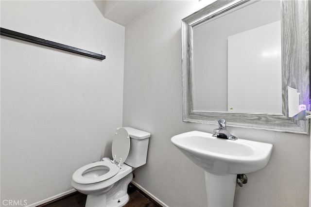 25323 Bayside Pl, Harbor City, CA 90710 - half bathroom featuring toilet and wood finished floors