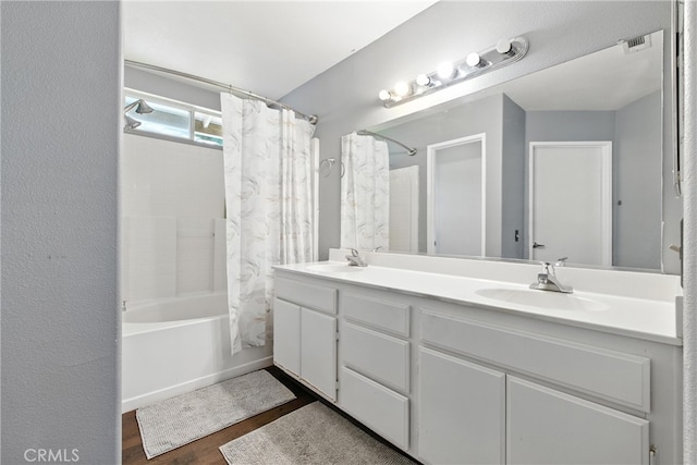 25323 Bayside Pl, Harbor City, CA 90710 - bathroom with shower / bath combo with shower curtain, double vanity, and wood finished floors
