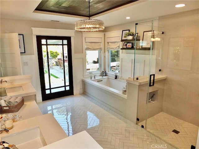 1820 Carfax Ave, Long Beach, CA 90815 - bathroom featuring a stall shower, a chandelier, a bath, double vanity, and a tray ceiling