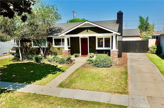 1820 Carfax Ave, Long Beach, CA 90815 - view of front facade with concrete driveway, a chimney, a porch, and roof with shingles