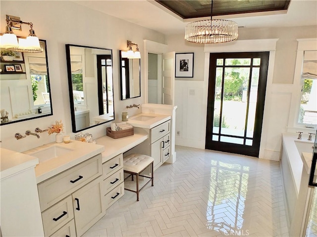1820 Carfax Ave, Long Beach, CA 90815 - full bathroom featuring a raised ceiling, a garden tub, vanity, and a chandelier