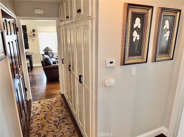 1820 Carfax Ave, Long Beach, CA 90815 - hall featuring dark wood-style flooring and baseboards