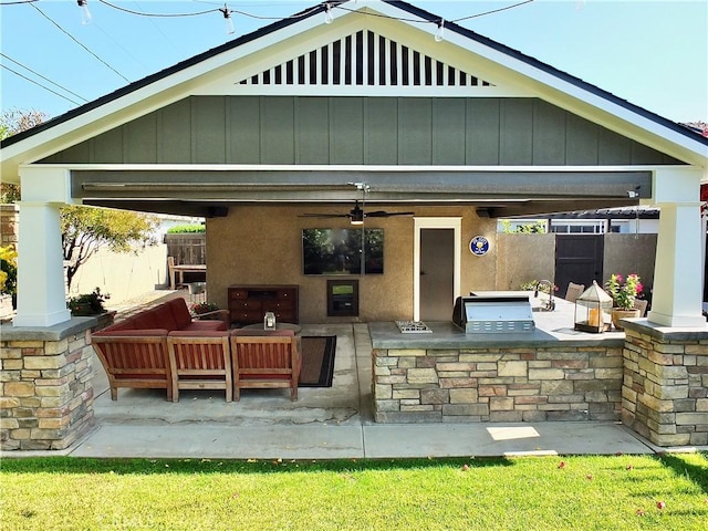 1820 Carfax Ave, Long Beach, CA 90815 - rear view of property featuring exterior kitchen, a patio area, an outdoor hangout area, board and batten siding, and ceiling fan
