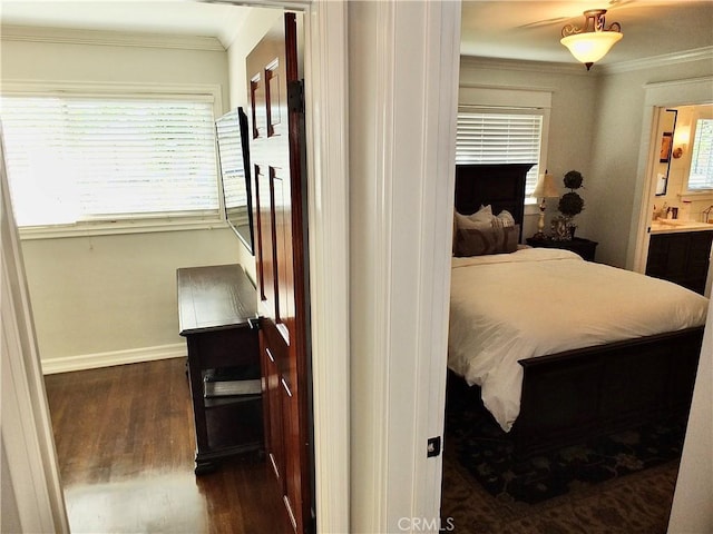 1820 Carfax Ave, Long Beach, CA 90815 - bedroom with crown molding, dark wood-style floors, baseboards, multiple windows, and ensuite bath