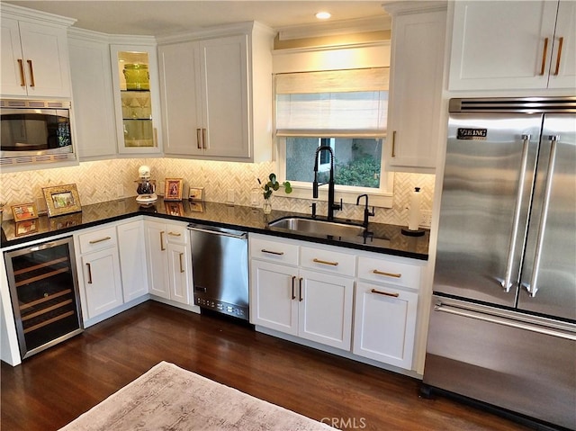 1820 Carfax Ave, Long Beach, CA 90815 - kitchen with built in appliances, wine cooler, a sink, dark wood finished floors, and white cabinetry