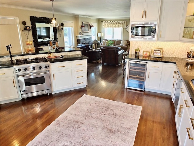 1820 Carfax Ave, Long Beach, CA 90815 - kitchen featuring wine cooler, appliances with stainless steel finishes, crown molding, dark wood-style floors, and white cabinetry