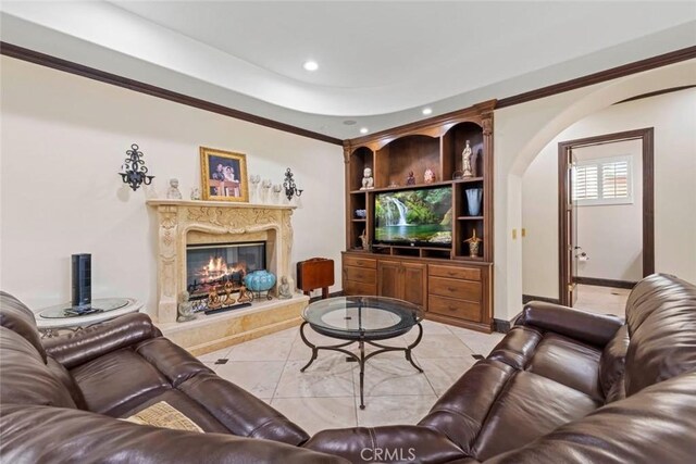 14667 Tyler St, Sylmar, CA 91342 - living room with arched walkways, recessed lighting, light tile patterned flooring, a premium fireplace, and baseboards