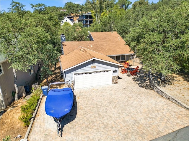 2303 Ridge Rider Rd, Bradley, CA 93426 - view of front of property featuring an attached garage, decorative driveway, and stone siding