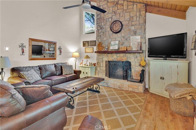 2303 Ridge Rider Rd, Bradley, CA 93426 - living room with a ceiling fan, wood finished floors, a stone fireplace, high vaulted ceiling, and wooden ceiling with exposed beams
